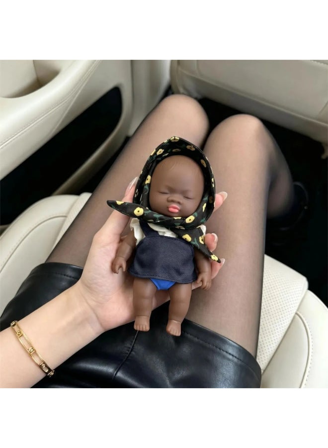 The 14cm Natasha doll, a popular internet sensation, is a stress-relieving toy and a great way to prank office workers and alleviate anxiety. It even comes with clothes! - Image 1