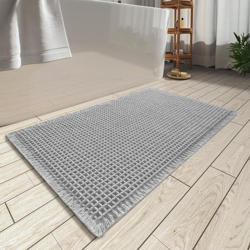 AMOAMI Upgraded Waffle Bath Mat Super Absorbent Non Slip Bath Mats for Bathroom Floor Machine Washable Bathroom Rugs with Tassels Rubber Backed Bathroom Mats Ultra Soft 18 x 30 Grey
