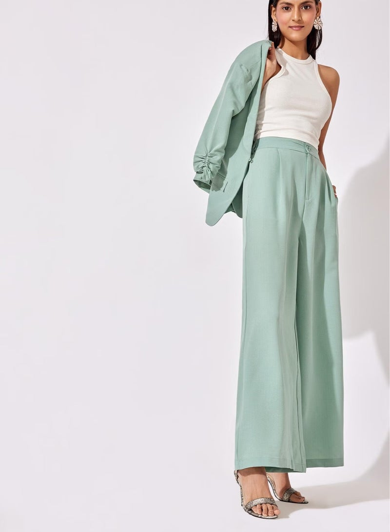 The Label Life Sage Green Pleated Flare Pants – Trendy & Comfortable - Image 1