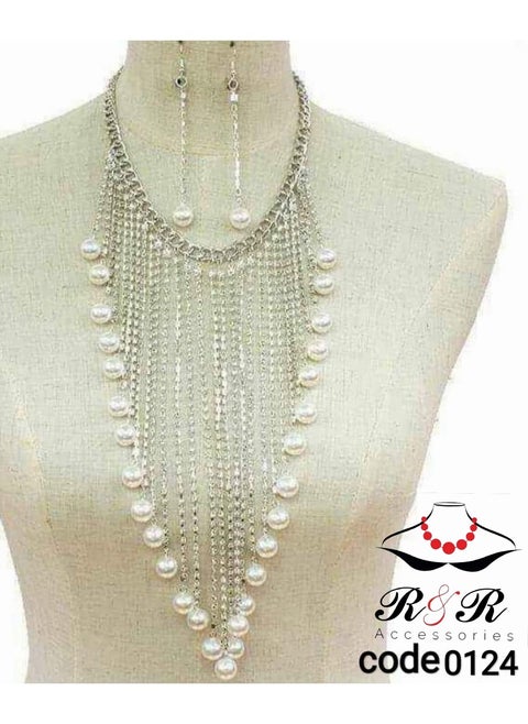 A women's necklace and earring set with multiple chains and the Mallorca v-shape