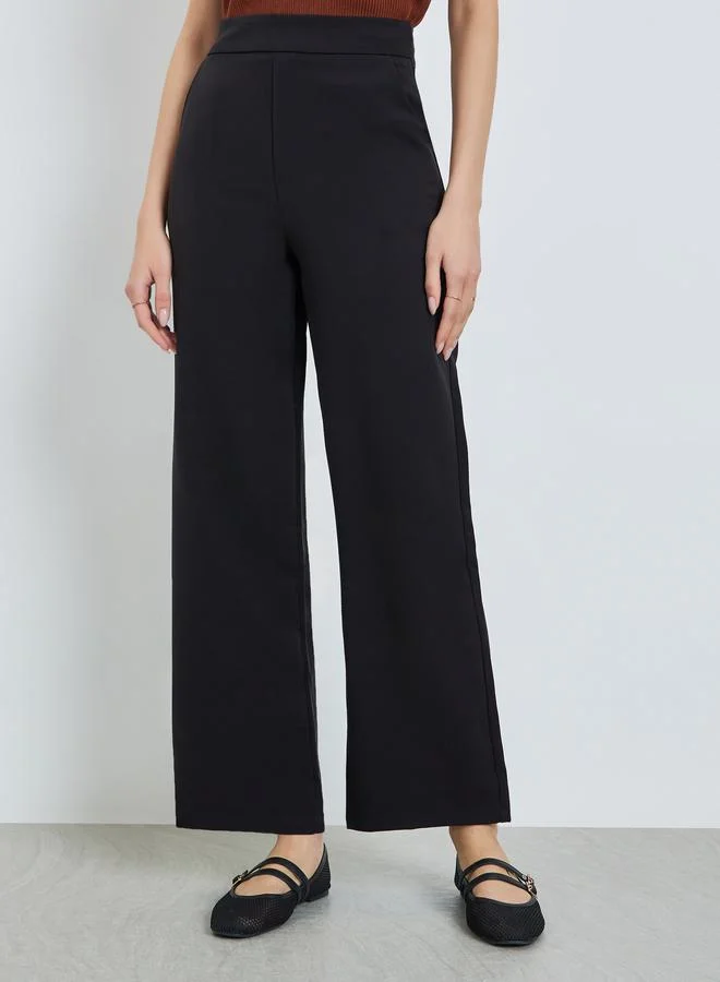 Take Two Black Solid High Rise Flared Pants