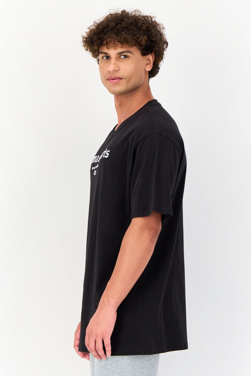 PUMA تي شيرت رجالي بقصة مريحة بأكمام قصيرة، أسود - Image 3