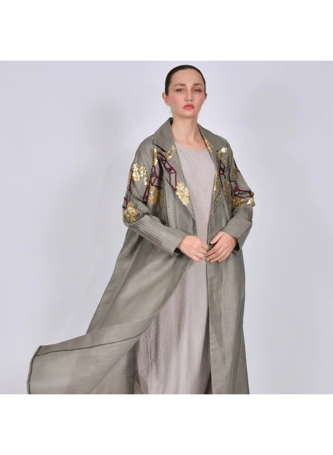 HAWRAA ABAYA Formal cut abaya in gray, decorated with bright colored embroidery and beading.