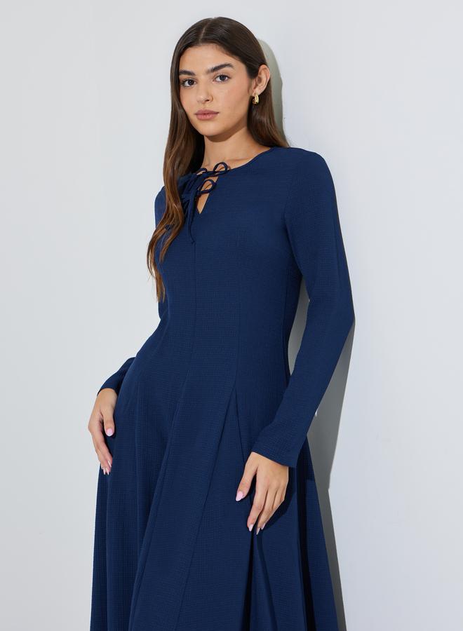 Styli Navy Blue Textured Pleated Details Tie-Up Neck A-Line Maxi Dress - Image 2