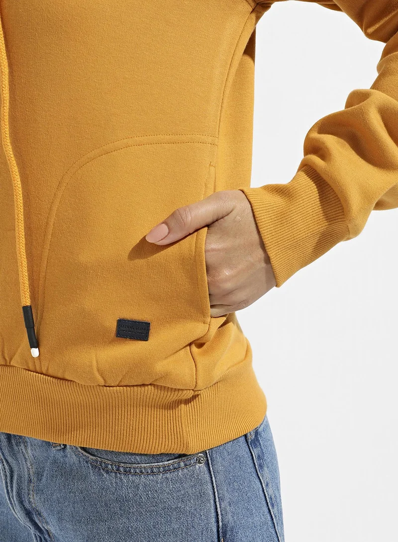Campus Sutra Women's Yellow Pullover Sweatshirt With Cold Shoulder Sleeve For Casual Wear | Hood Neck | Long Sleeve | Pull On Closure | Cotton Sweatshirt Crafted With Comfort Fit For Everyday Wear