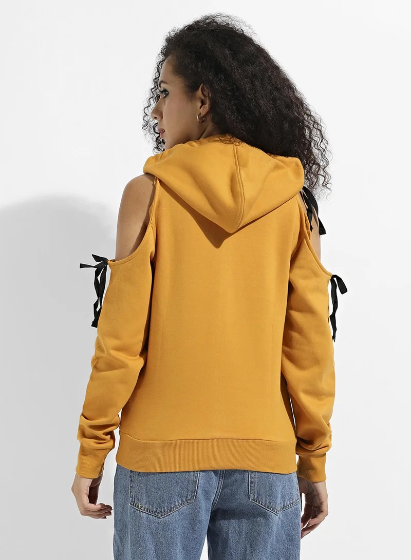 Campus Sutra Women's Yellow Pullover Sweatshirt With Cold Shoulder Sleeve For Casual Wear | Hood Neck | Long Sleeve | Pull On Closure | Cotton Sweatshirt Crafted With Comfort Fit For Everyday Wear