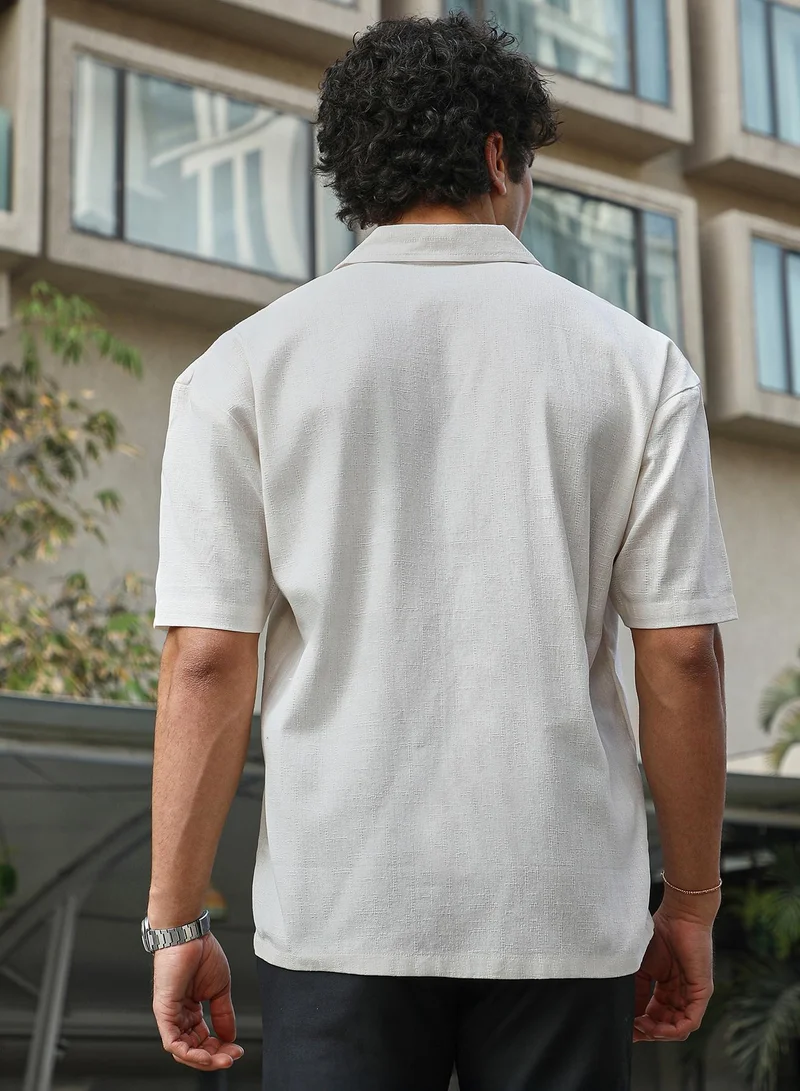 Campus Sutra Campus Sutra Men's Ivory White Solid Resort Overised Shirt For Casual Wear | Cuban Collar | Short Regular Sleeves | Button Closure | Oversized Shirt Crafted With Comfort Fit For Everyday Wear