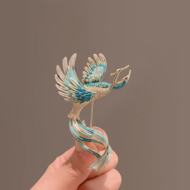 The Black Pearl Accessories Golden Blue Zirconic Phoenix Brooch - Image 1