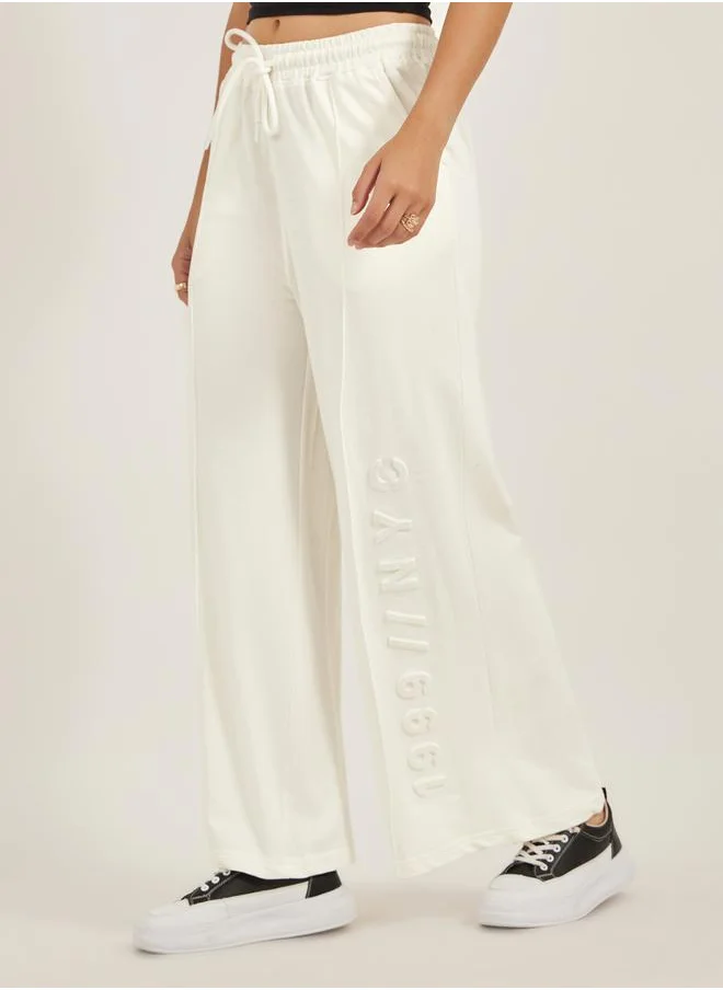 ستايلي Embossed Hem Wide Leg Joggers with Drawstring Waist