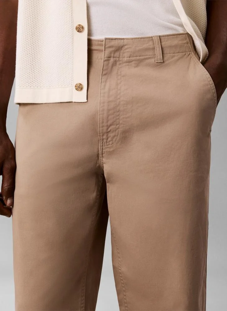 Calvin Klein Jeans Roasted Cashew 90s Loose Cropped Chino Trousers for Men | Best Price UAE