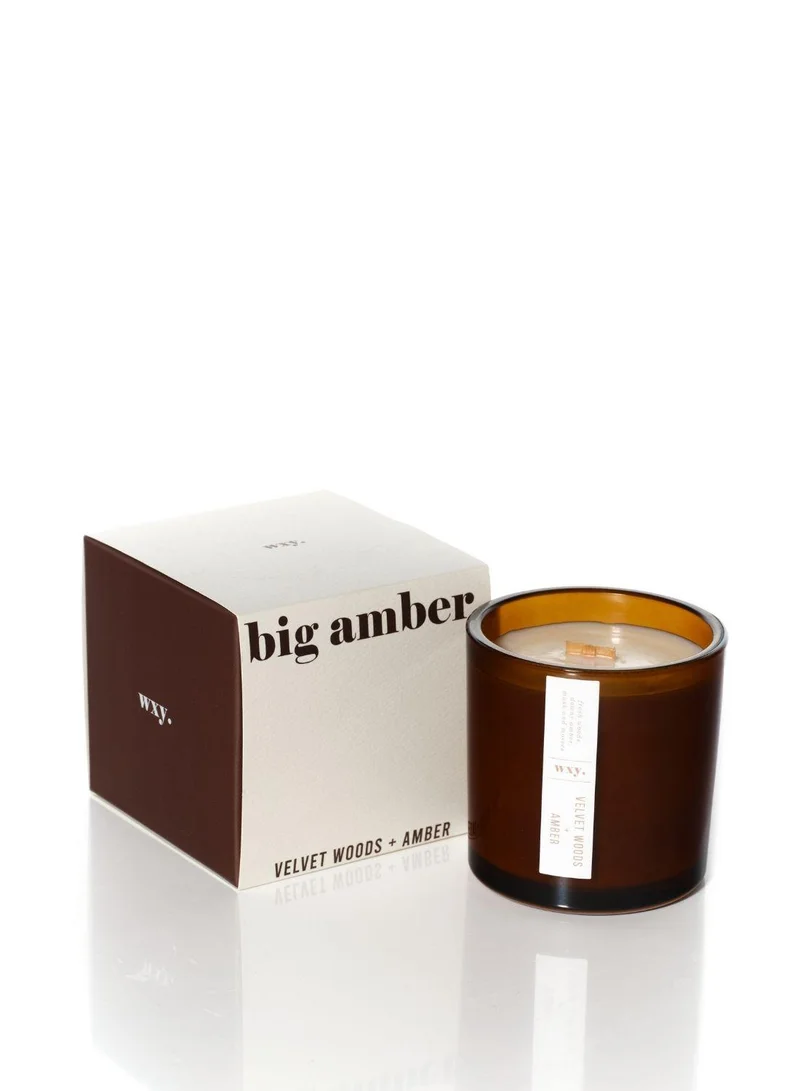 دبليو اكس واي شمعة  معطرة آمبر برائحة الخشب المخملي والعنبر