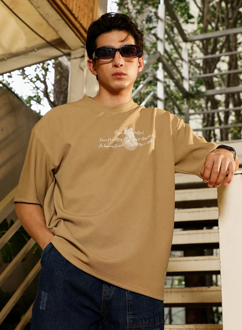 Campus Sutra Campus Sutra Men's Sand Beige Boxy Mytho-Modernism T-Shirt | Round Neck , Short  Regular Sleeves , Pull On Closure | Graphic Placement Print Waffle | Cotton-Blend T-Shirt For Casual Wear