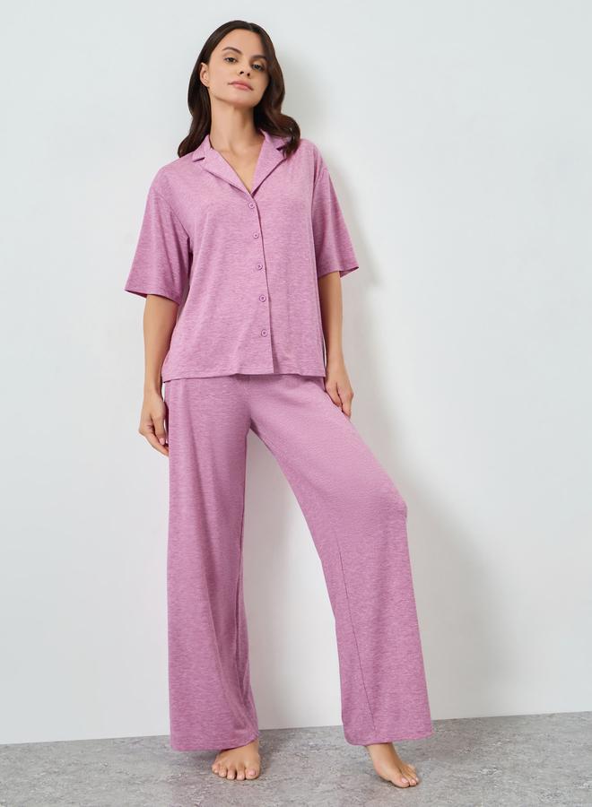 A pajamas set of pants and a knitted blouse with s...