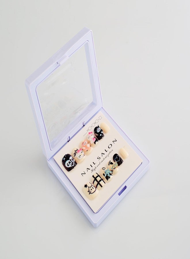 شيري بوكس مجموعة أظافر كرتونية ثلاثية الأبعاد جميلة وجذابة من CherryBox، مكونة من 12 قطعة، مناسبة للأطفال والكبار، بتصميمات كرتونية وعصرية (أسود وكريمي). تتضمن المجموعة لاصق أظافر، ومبرد أظافر، وقطعة تنظيف. - Image 3