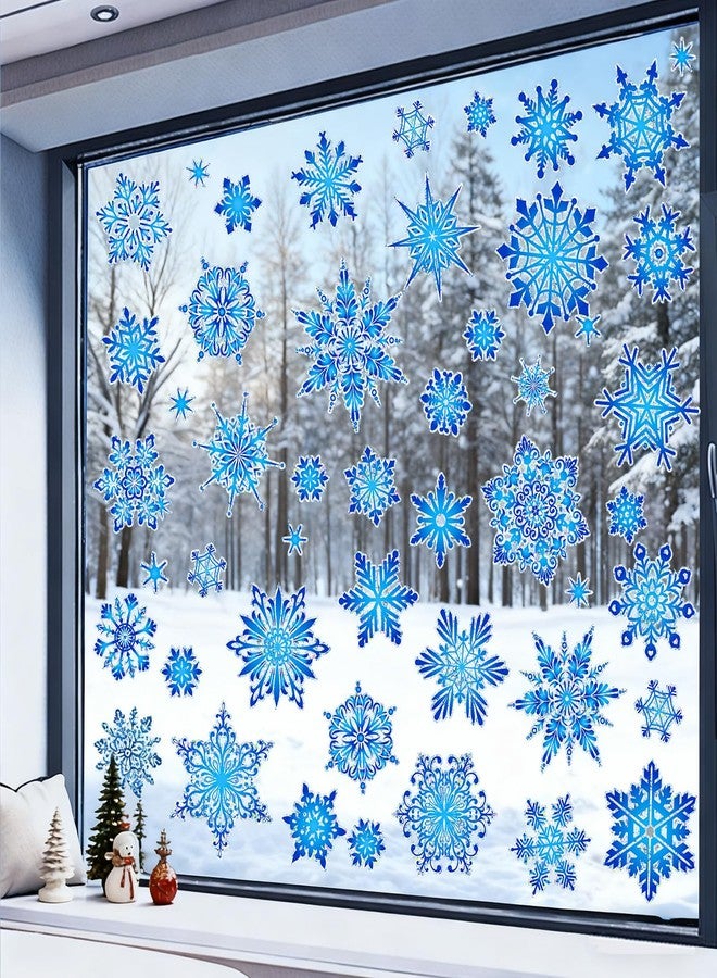 كونسيت مجموعة كونسايت من 112 قطعة من ملصقات النوافذ على شكل ندفة ثلجية بألوان قوس قزح، ملصقات مزدوجة الجوانب لنوافذ عيد الميلاد، لحماية الزجاج من اصطدام الطيور، ديكور أزرق لعيد الميلاد، ملصقات ثابتة قابلة لإعادة الاستخدام لتزيين الشتاء - Image 1