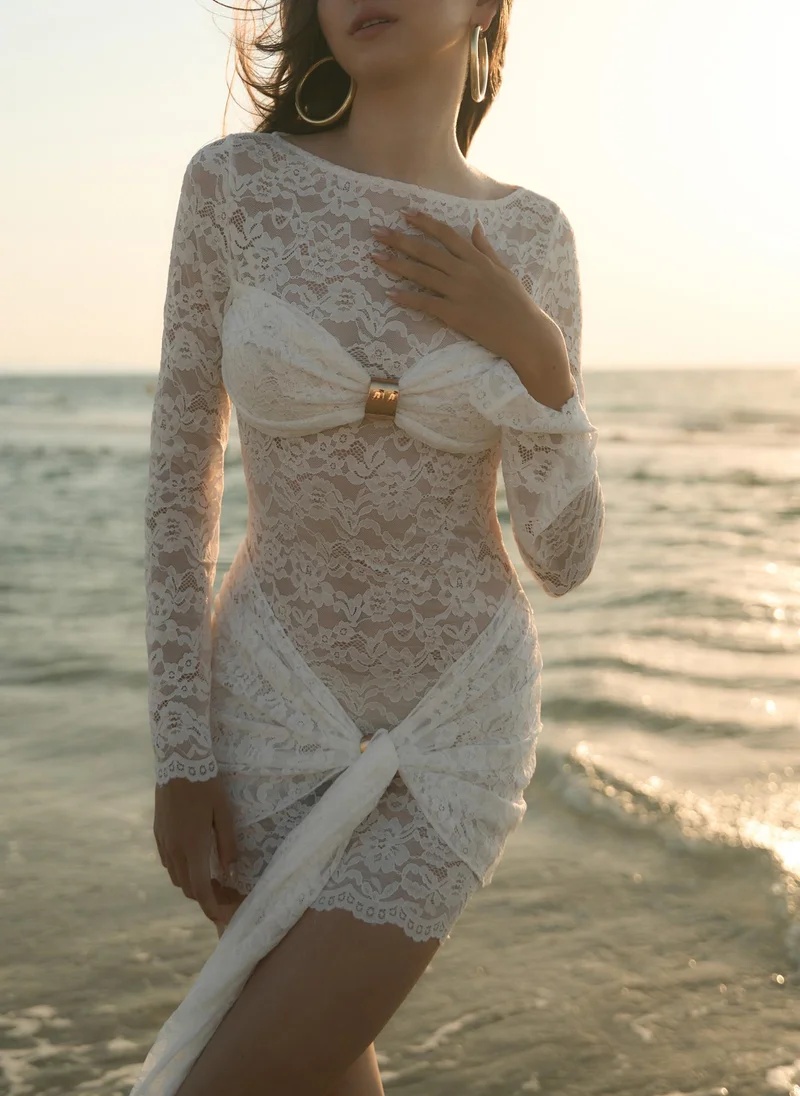 Guipure mini dress with draped neckline and golden decor