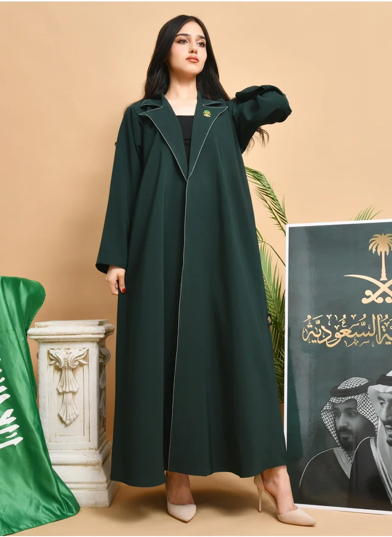 HAWRAA ABAYA Abaya with a quarter-cloth blazer design, with white embroidery on the collar, decorated with a brooch in the shape of two swords and a palm tree.