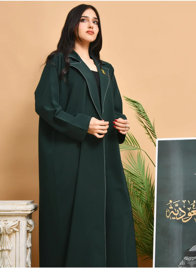 HAWRAA ABAYA Abaya with a quarter-cloth blazer design, with white embroidery on the collar, decorated with a brooch in the shape of two swords and a palm tree.