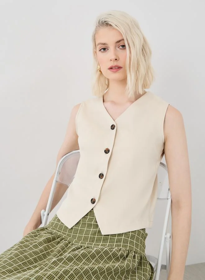 تايك تو بلوزة بدون أكمام بياقة على شكل حرف  وأزرار