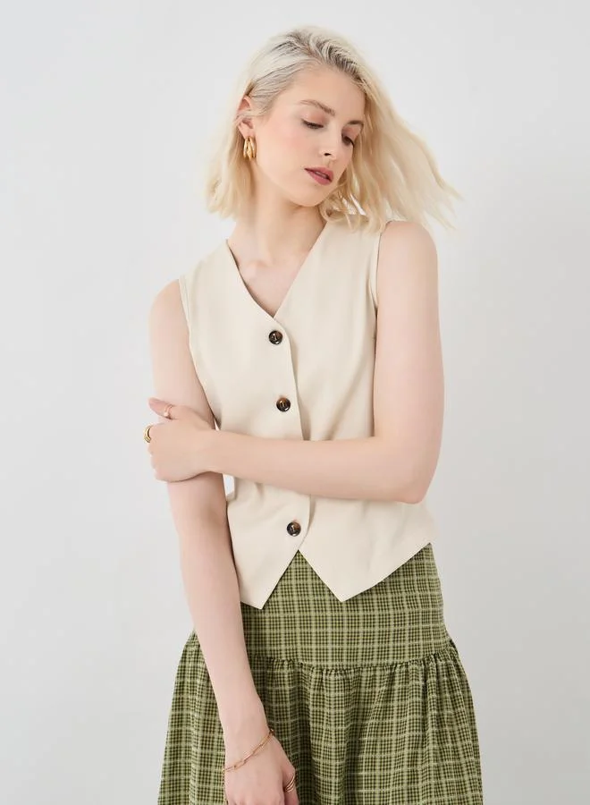 تايك تو بلوزة بدون أكمام بياقة على شكل حرف  وأزرار