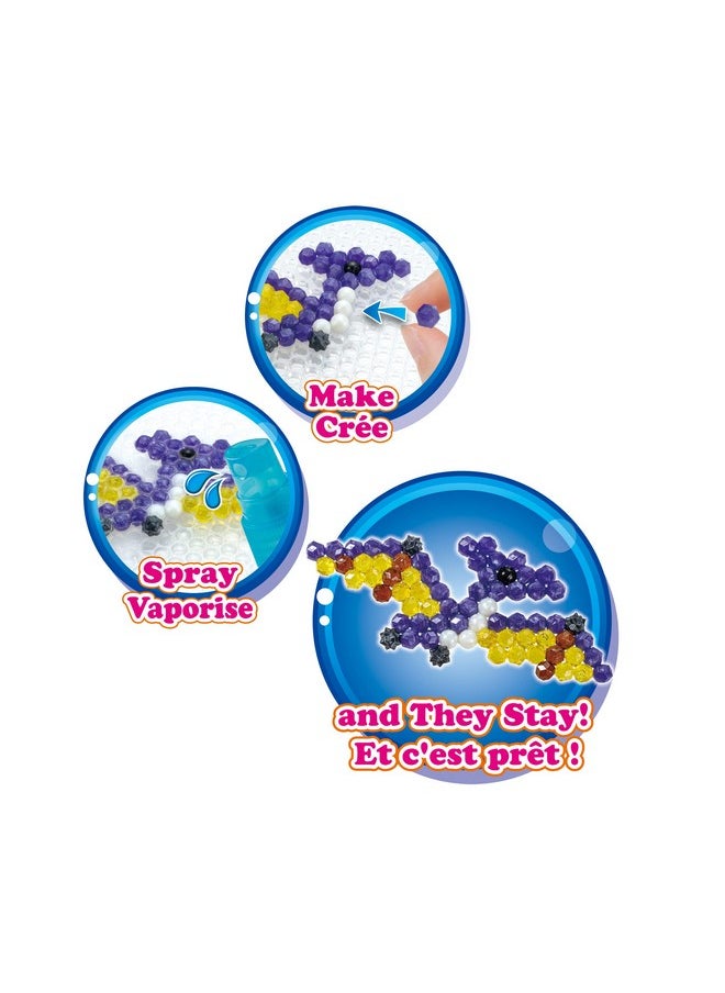 Aquabeads Dinosaur World - Arts & Crafts Kit for Kids Ages 4+ - Includes Over 1200 Shiny Beads, Layout Tray, Sprayer, Creation Display, Design Pegs, Keychain Accessories, and Template Sheet