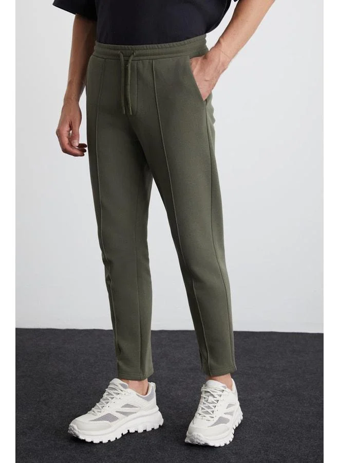 GRIMELANGE Scuby Men's Regular Fit Comfortable Cut Grooved Waist Elastic Three-Pocket Green Sweatpants.