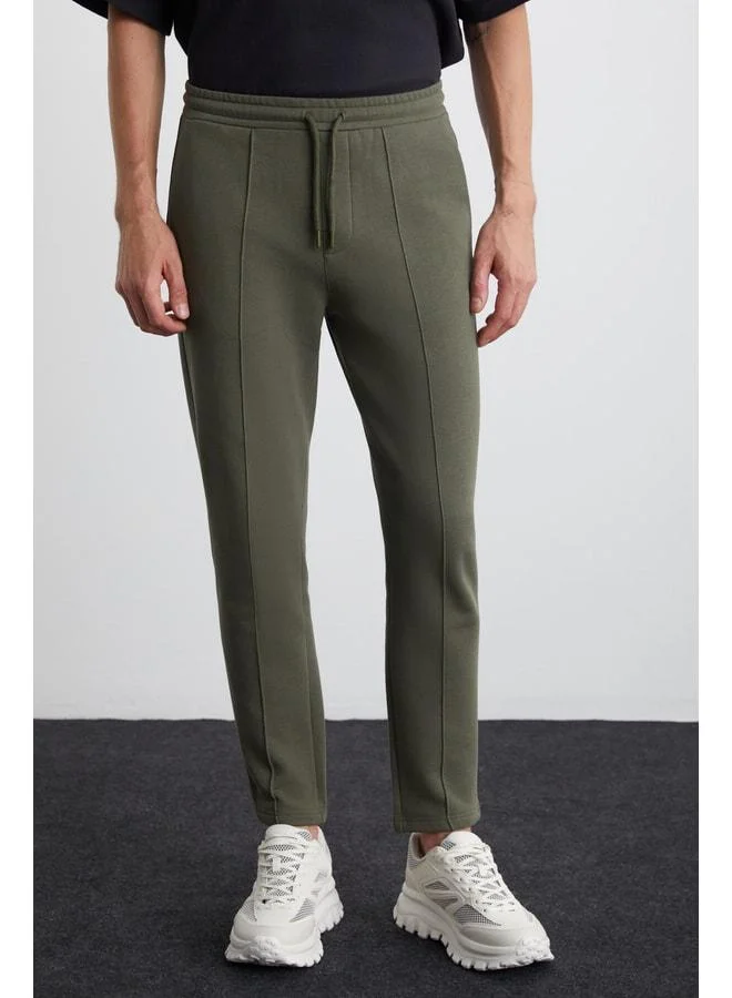 GRIMELANGE Scuby Men's Regular Fit Comfortable Cut Grooved Waist Elastic Three-Pocket Green Sweatpants.