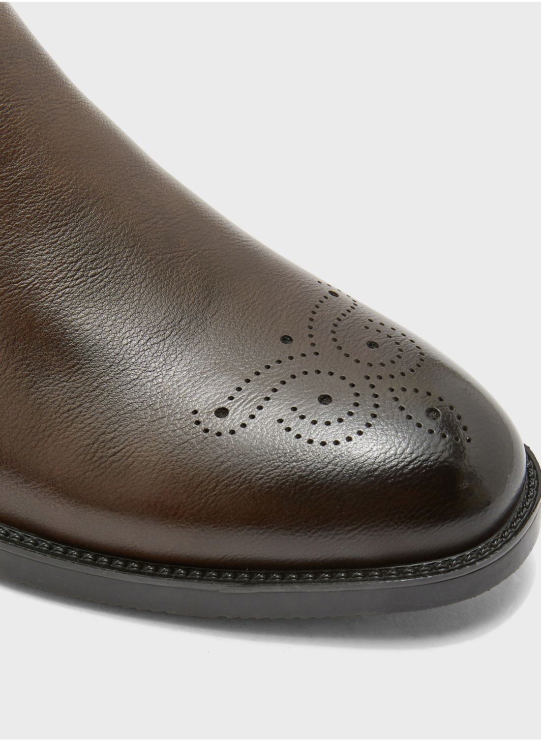 Chelsea Boots - https://f.nooncdn.com/p/pzsku/Z6188C5D246730EE8B1C6Z/45/1746747391/a548369e-5e0b-4cc1-a944-7348cdf860ad.jpg?width=original