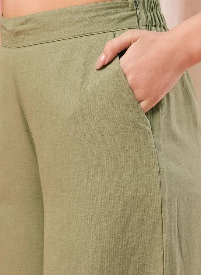 Globus Olive Mid Rise Semi Elastic Waist Opaque Wide Leg Palazzos for Women | Best Price UAE