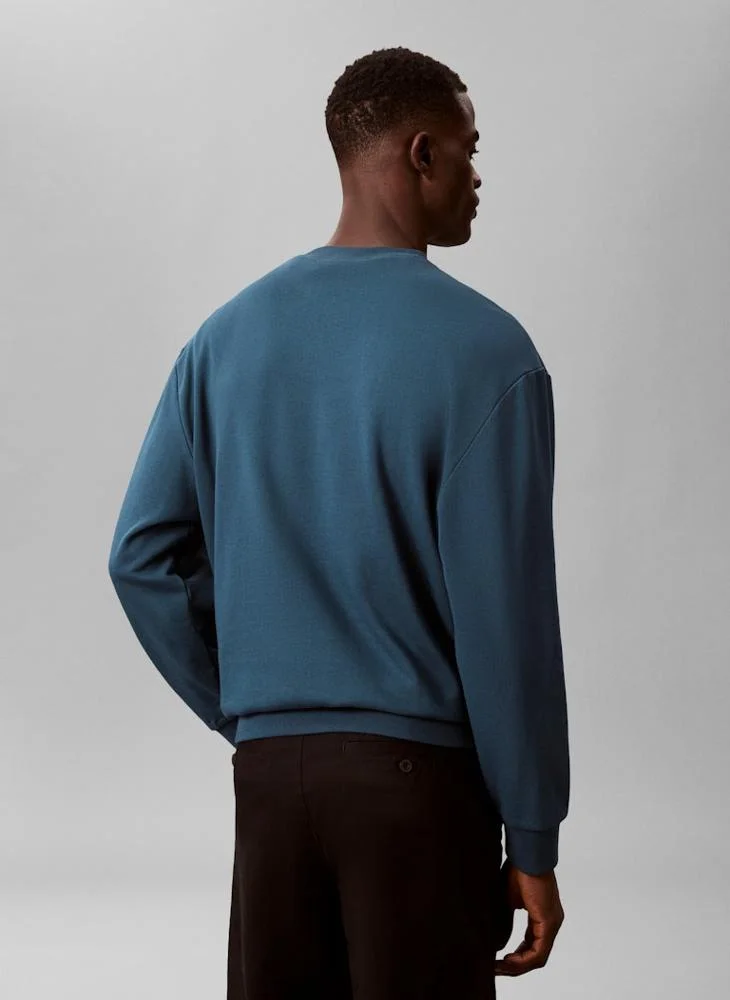 كالفن كلاين جينز بلوزة بأكمام طويلة ورقبة دائرية