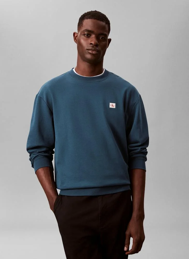 كالفن كلاين جينز بلوزة بأكمام طويلة ورقبة دائرية