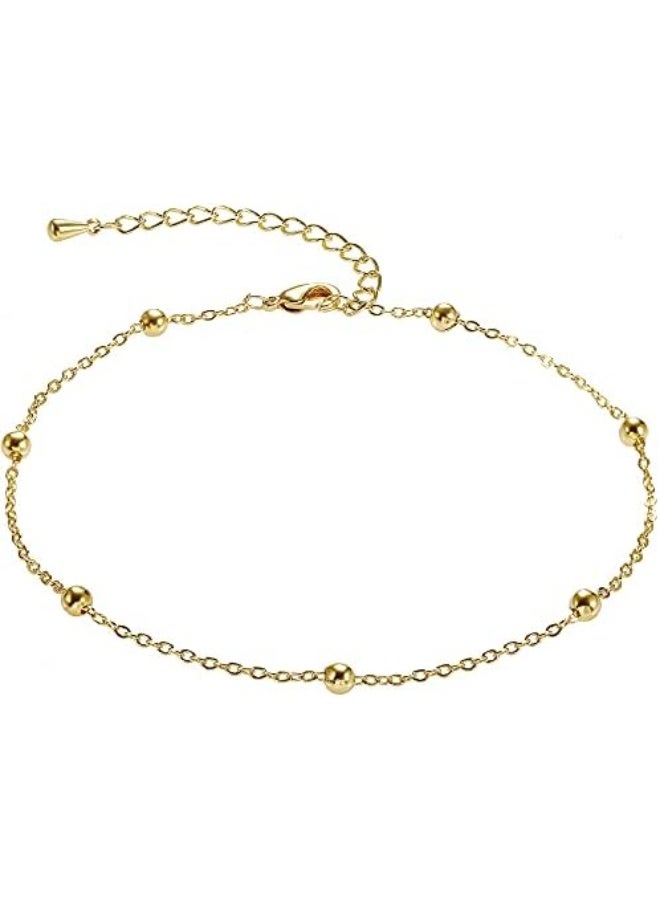 Luxuria A simple and delicate gold anklet studded with small spherical beads distributed along the chain, the "satellite" anklet. - Image 1