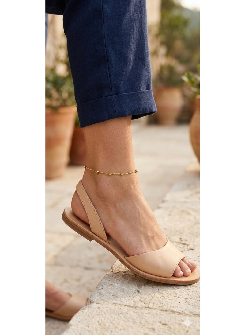 Luxuria A simple and delicate gold anklet studded with small spherical beads distributed along the chain, the "satellite" anklet. - Image 4