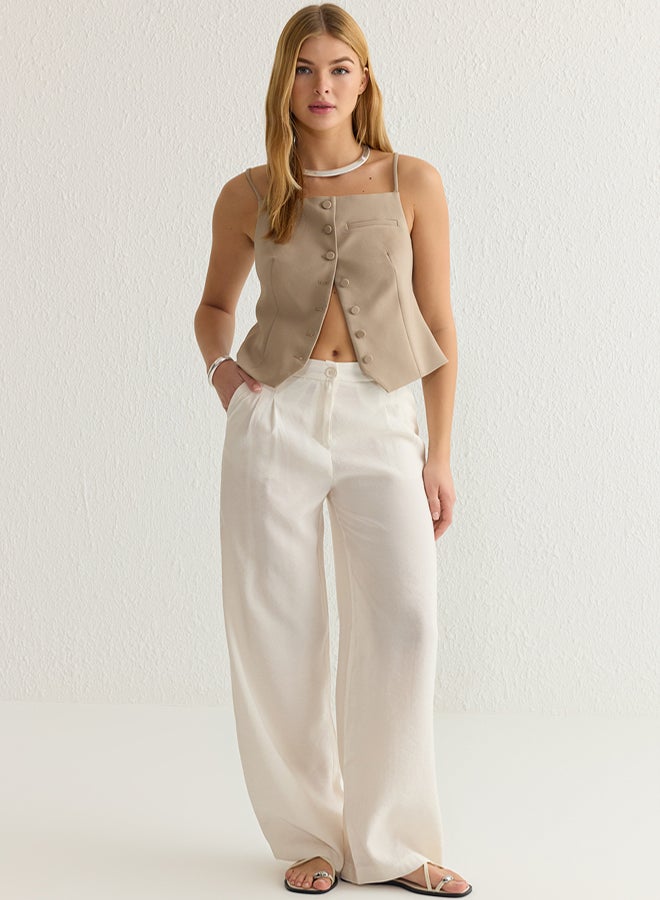 trendyol بنطلون واسع منسوج بلمسة ناعمة باللون البيج - Image 1