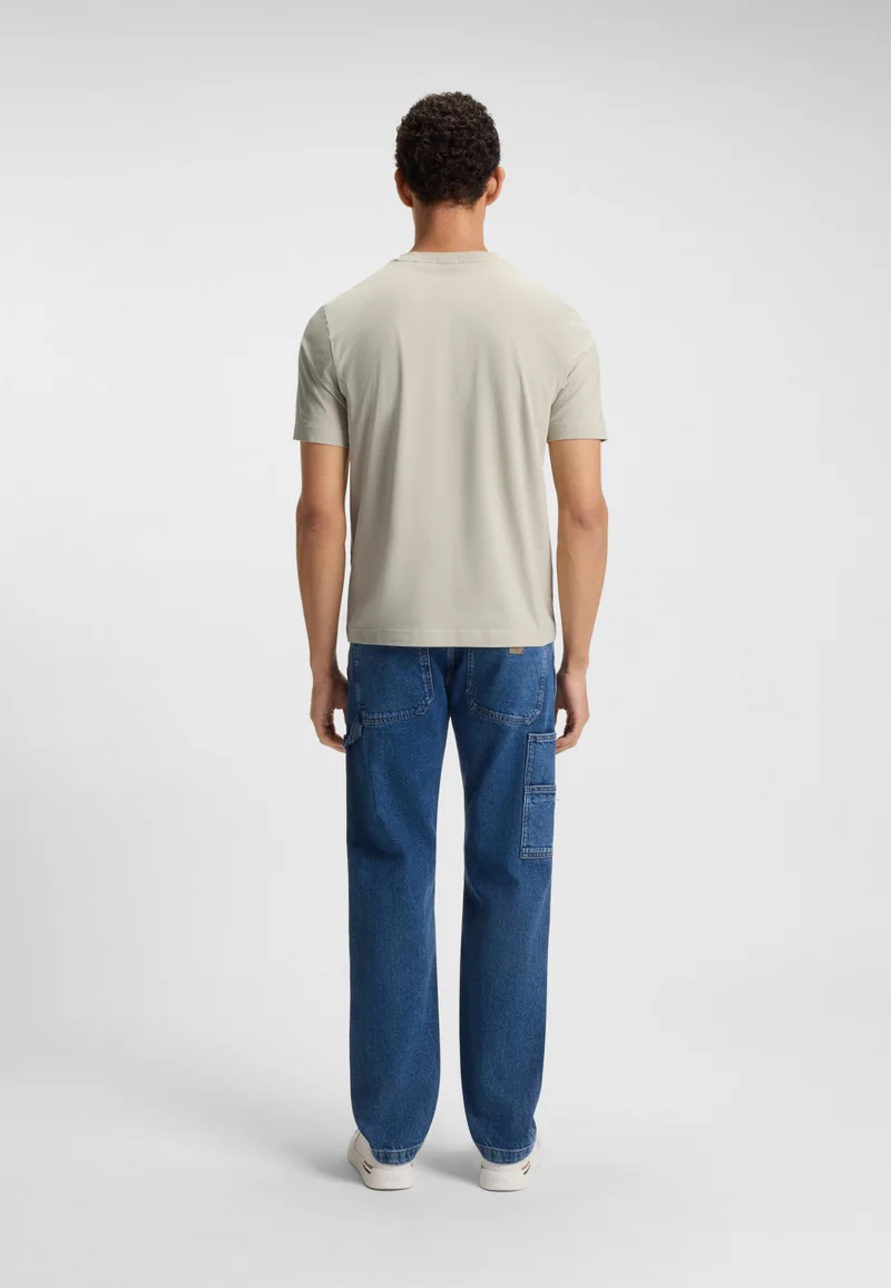 بوس تيشيرت بقصة مريحة قطن مطاطي بطبعة شعار