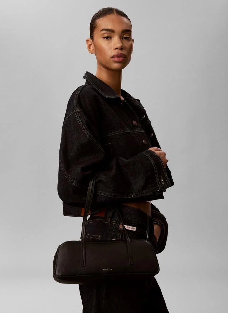 Calvin Klein  Metallic Logo Textured Barrel Bag for Women | Best Price UAE