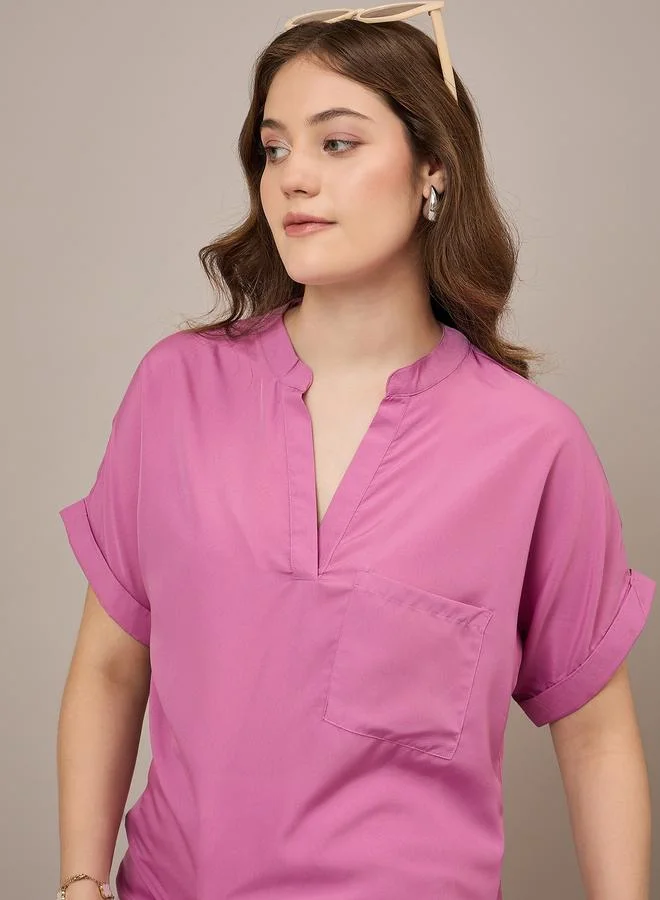 كواري بلوزة بقصة عادية مع جيب مرقع