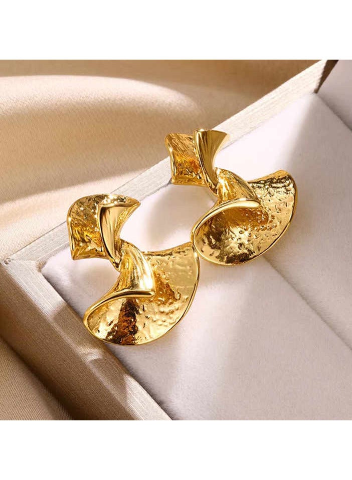 "Twister Gold Earrings, an elegant design that adds a touch of luxury to your look."