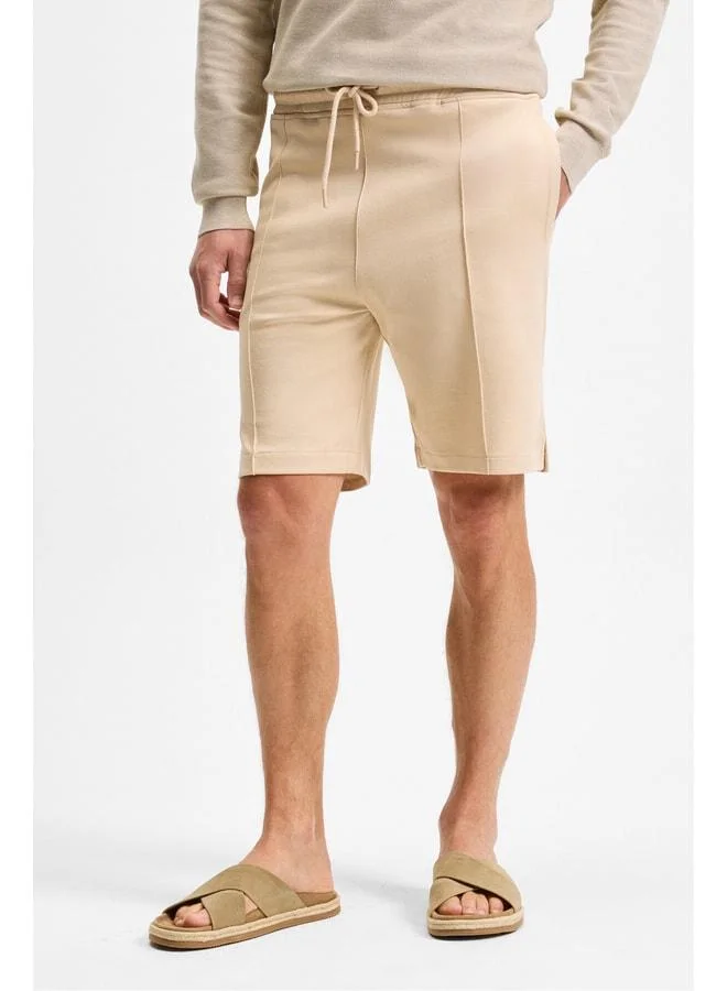 GRIMELANGE MATSEN Men's Elastic Waist Relaxed Beige Shorts with Side and Back Pockets.
