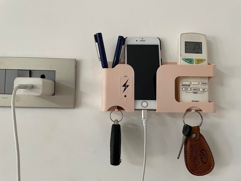 GEOCARTER Mobile Phone Charging Stand Multi-Functional Storage Wall Mounted Ac Remote Holder Self Adhesive Bedside Fixed Rack Bedroom Office Accessories Apricot Pack of 1 - Image 1