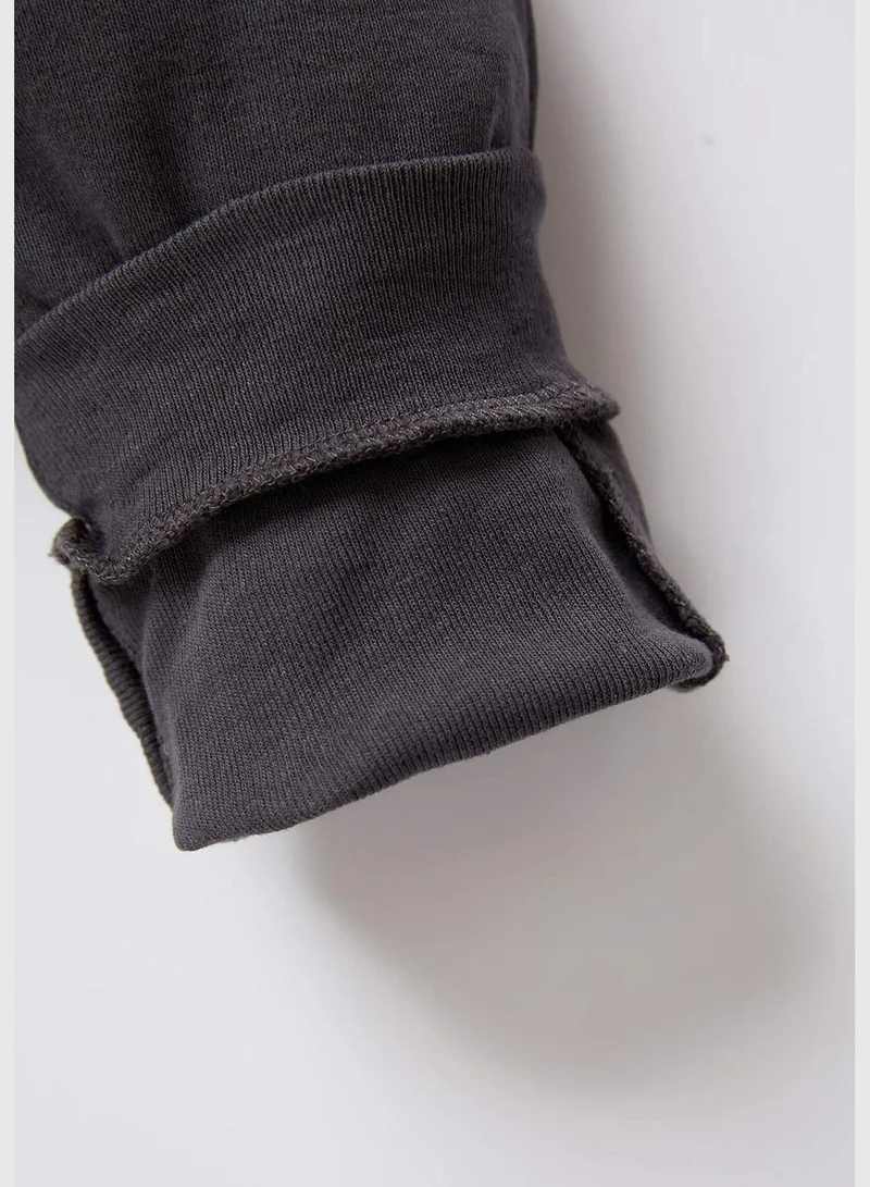 ديفاكتو Flinstones Licenced Long Sleeve Newborn Sleepsuit