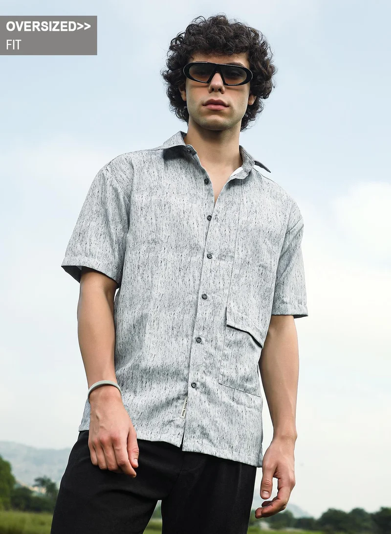 Campus Sutra Campus Sutra Men's Coin Grey Speckled Flap Oversized Shirt For Casual Wear | Spread Collar | Short Regular Sleeves | Button Closure | Oversized Shirt Crafted With Comfort Fit For Everyday Wear