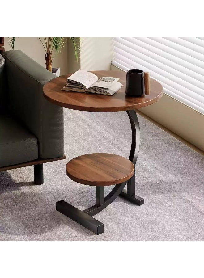 A modern, elegant, round, two-tiered side table with sturdy metal legs offers unique style in one convenient spot for coffee, your laptop, or your favorite book. Its pleasing design adds a touch of beauty to any corner of your space. - Image 3