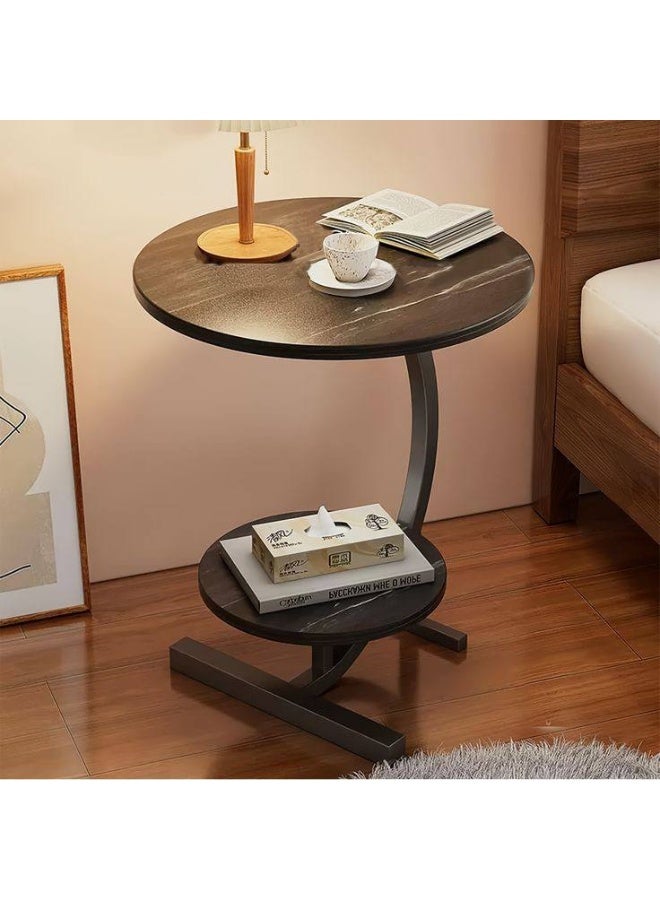 A modern, elegant, round, two-tiered side table with sturdy metal legs offers unique style in one convenient spot for coffee, your laptop, or your favorite book. Its pleasing design adds a touch of beauty to any corner of your space. - Image 1