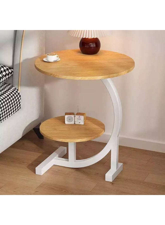 A modern, elegant, round, two-tiered side table with sturdy metal legs offers unique style in one convenient spot for coffee, your laptop, or your favorite book. Its pleasing design adds a touch of beauty to any corner of your space. - Image 4