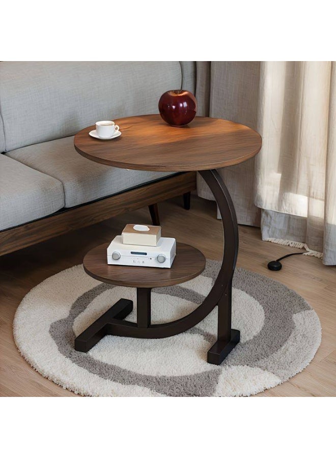 A modern, elegant, round, two-tiered side table with sturdy metal legs offers unique style in one convenient spot for coffee, your laptop, or your favorite book. Its pleasing design adds a touch of beauty to any corner of your space. - Image 2