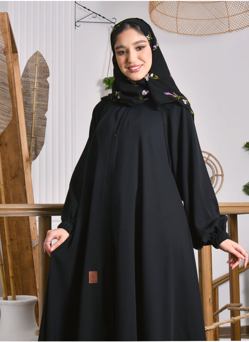 HAWRAA ABAYA - A closed abaya with a cloche cut and a slit at the back with a button and cuffed sleeves - Image 1