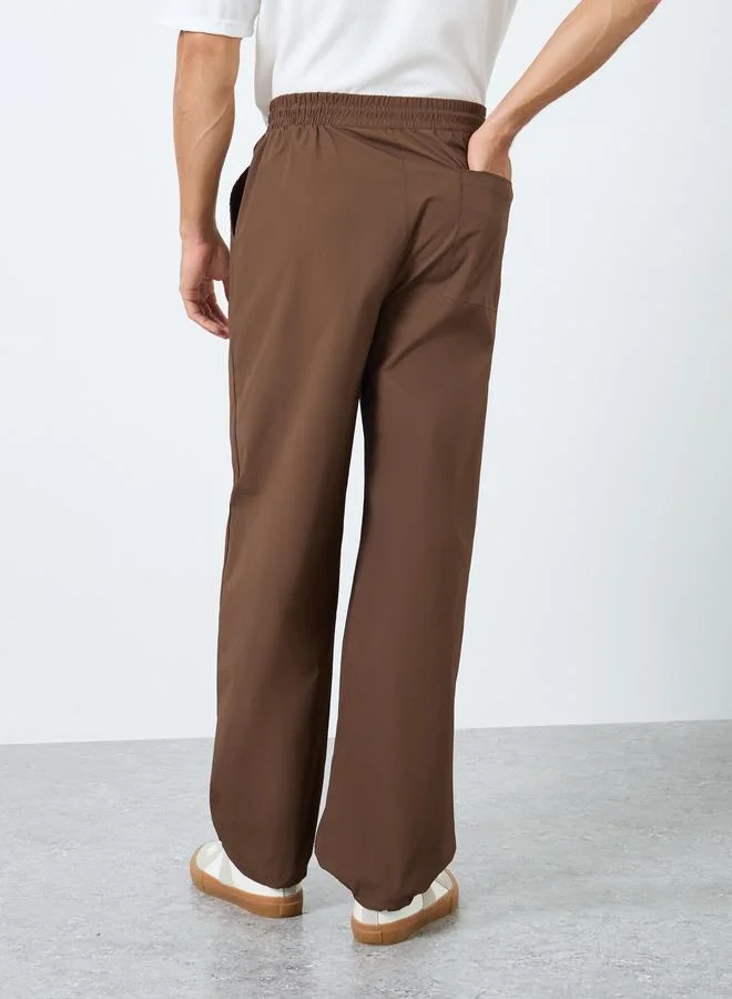 Styli  Oversized Parachute Pants with Drawstring for Men | Best Price UAE