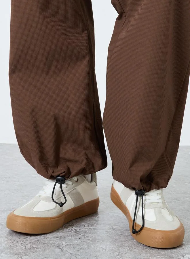 Styli  Oversized Parachute Pants with Drawstring for Men | Best Price UAE