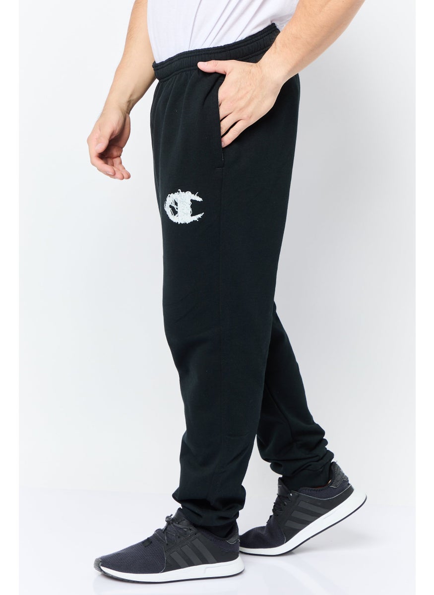 Champion - Men Sportswear Fit Graphic Print Outdoor Sweatpants, Black - Image 1